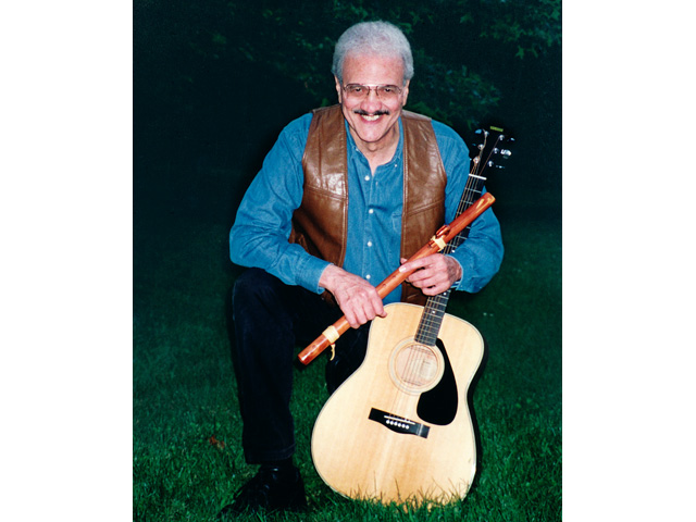 Jay Gullo with flute and guitar