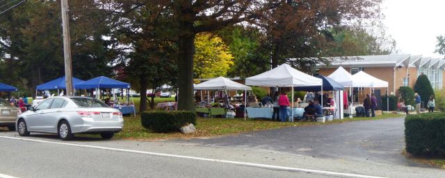 street view of 18 crafters outside, mostly under tents